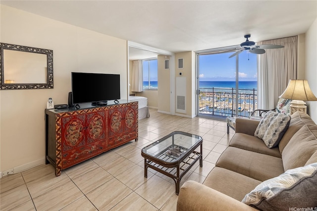 1765 Ala Moana Blvd Unit 1286, Honolulu, HI 96815 - living area with light tile patterned floors, ceiling fan, baseboards, and a wall of windows