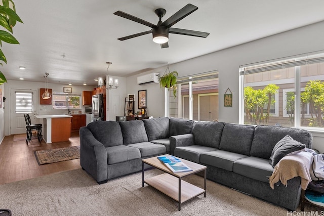 724 Kakala St Unit 2101, Kapolei, HI 96707 - living room with a wall mounted air conditioner, a chandelier, a ceiling fan, wood finished floors, and recessed lighting