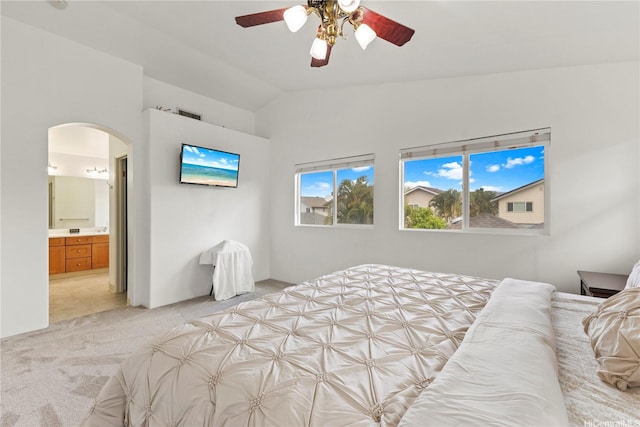 91-1004 Kaiapo St, Ewa Beach, HI 96706 - bedroom featuring light colored carpet, arched walkways, lofted ceiling, connected bathroom, and ceiling fan
