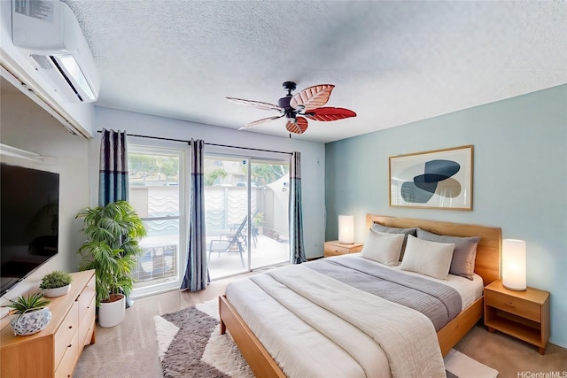 44-3082 Olina St Unit 5/2, Kaneohe, HI 96744 - bedroom featuring access to outside, a textured ceiling, a wall mounted AC, and a ceiling fan