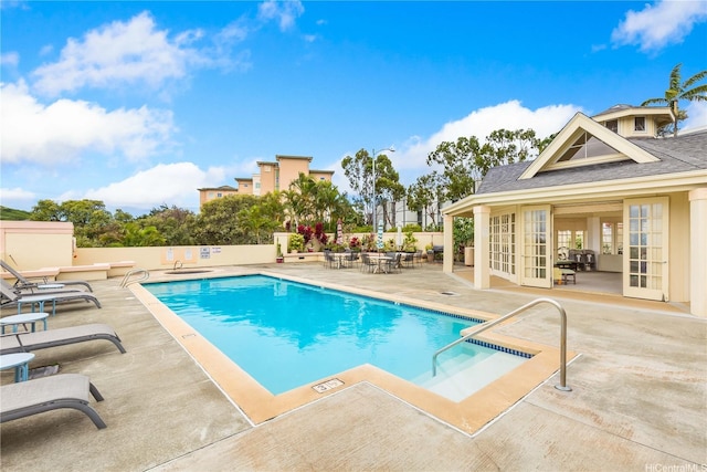 1340 Moanalualani Pl Unit 4D, Honolulu, HI 96819 - community pool featuring a patio area, french doors, and fence