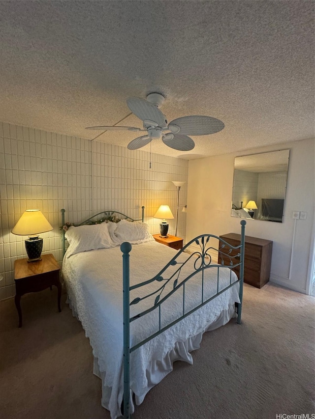 95-146 Kuahelani Ave Unit 131, Mililani, HI 96789 - bedroom with carpet flooring, a textured ceiling, ceiling fan, and tile walls