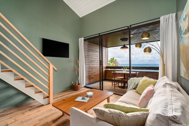 51-636 Kamehameha Hwy Unit 323, Kaaawa, HI 96730 - living room featuring wood finished floors, stairway, and lofted ceiling
