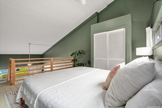 51-636 Kamehameha Hwy Unit 323, Kaaawa, HI 96730 - bedroom featuring vaulted ceiling, a closet, and wood finished floors