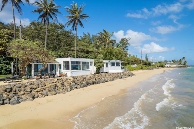 53-797 Kamehameha Hwy, Hauula, HI 96717 - view of front of home with a sunroom and view of water and beach