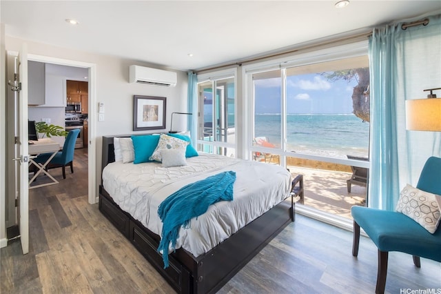 53-797 Kamehameha Hwy, Hauula, HI 96717 - bedroom with an AC wall unit, access to outside, wood finished floors, a water view, and recessed lighting