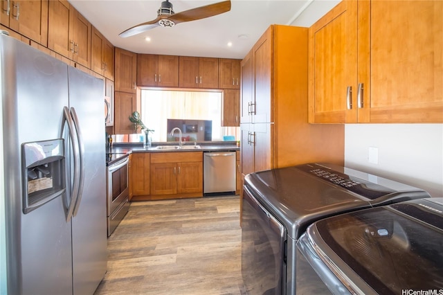 53-797 Kamehameha Hwy, Hauula, HI 96717 - kitchen with appliances with stainless steel finishes, a sink, brown cabinets, washing machine and clothes dryer, and ceiling fan