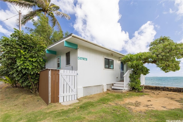 53-797 Kamehameha Hwy, Hauula, HI 96717 - view of side of home with a water view and a lawn