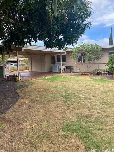 94-549 Pilimai St, Waipahu, HI 96797 - view of green lawn with central AC