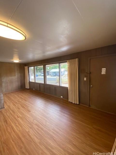 94-549 Pilimai St, Waipahu, HI 96797 - unfurnished room featuring light wood finished floors and wooden walls
