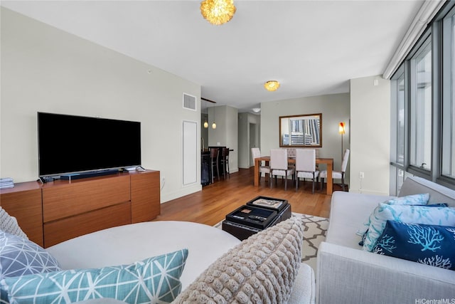 1189 Waimanu St Unit 1606, Honolulu, HI 96814 - living area featuring wood finished floors and baseboards
