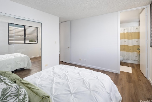 3070 Ala Ilima St Unit 306, Honolulu, HI 96818 - bedroom with wood finished floors, a closet, and a textured ceiling