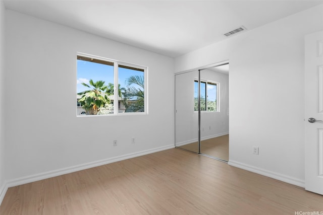 91-1023 Kaikoele St, Ewa Beach, HI 96706 - unfurnished bedroom featuring light wood-style flooring, baseboards, and a closet