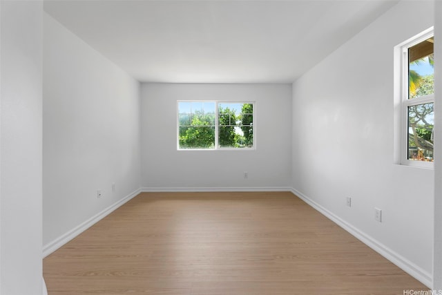 91-1023 Kaikoele St, Ewa Beach, HI 96706 - unfurnished room featuring plenty of natural light, light wood-type flooring, and baseboards