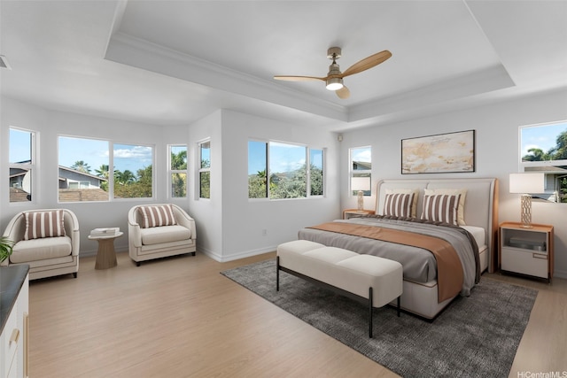 91-1023 Kaikoele St, Ewa Beach, HI 96706 - bedroom featuring a tray ceiling, light wood-style floors, crown molding, baseboards, and a ceiling fan