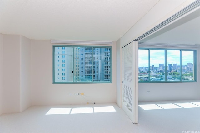 1314 Kalakaua Ave Unit 903, Honolulu, HI 96826 - carpeted spare room with a view of city