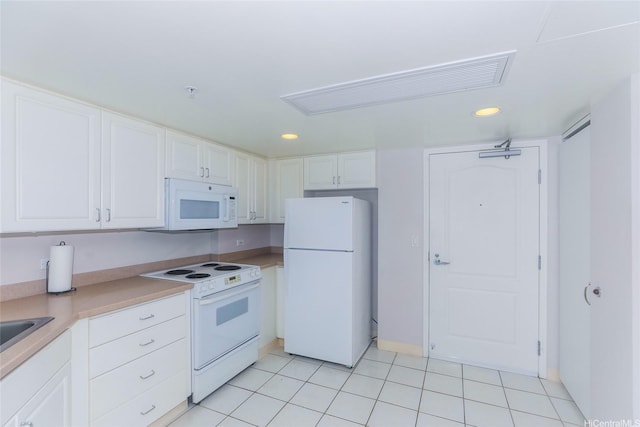 1314 Kalakaua Ave Unit 903, Honolulu, HI 96826 - kitchen featuring white appliances, white cabinets, recessed lighting, light tile patterned flooring, and light countertops
