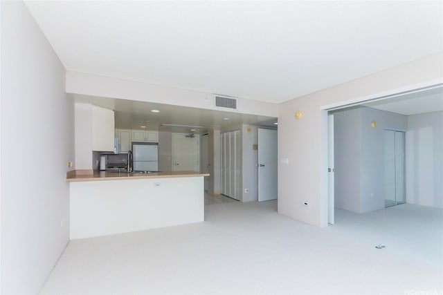 1314 Kalakaua Ave Unit 903, Honolulu, HI 96826 - unfurnished living room featuring light colored carpet