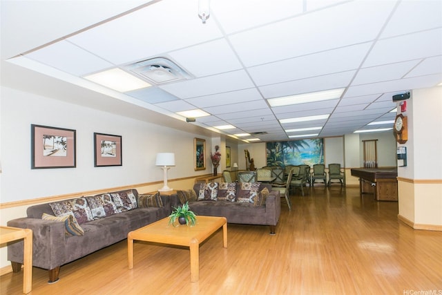 1314 Kalakaua Ave Unit 903, Honolulu, HI 96826 - living area featuring wood finished floors and a paneled ceiling