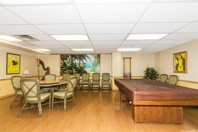 1314 Kalakaua Ave Unit 903, Honolulu, HI 96826 - dining room with billiards, wood finished floors, and a drop ceiling