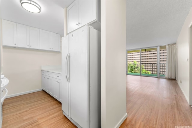 3020 Ala Napuaa Pl Unit 103, Honolulu, HI 96818 - hallway with light wood-type flooring and baseboards
