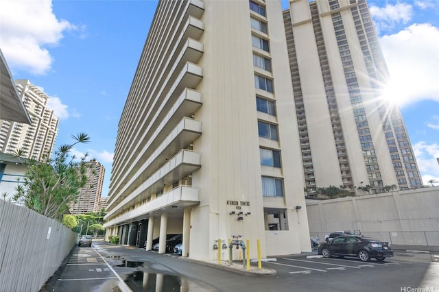 419A Atkinson Dr Unit 1203, Honolulu, HI 96814 - view of apartment building / complex featuring uncovered parking