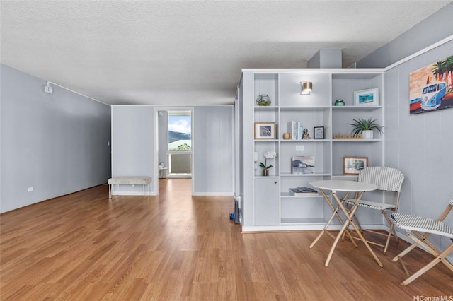 419A Atkinson Dr Unit 1203, Honolulu, HI 96814 - home office featuring wood finished floors, a textured ceiling, and baseboards