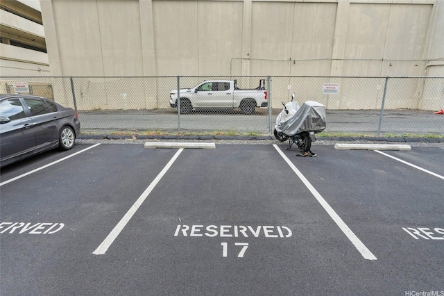 419A Atkinson Dr Unit 1203, Honolulu, HI 96814 - uncovered parking lot with fence
