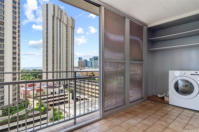 419A Atkinson Dr Unit 1203, Honolulu, HI 96814 - laundry room with washer / clothes dryer, a view of city, and tile patterned floors