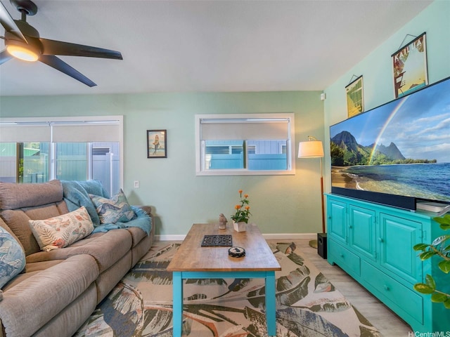 340 Manono St Unit 2, Kailua, HI 96734 - living room featuring light wood-style flooring, baseboards, and a ceiling fan