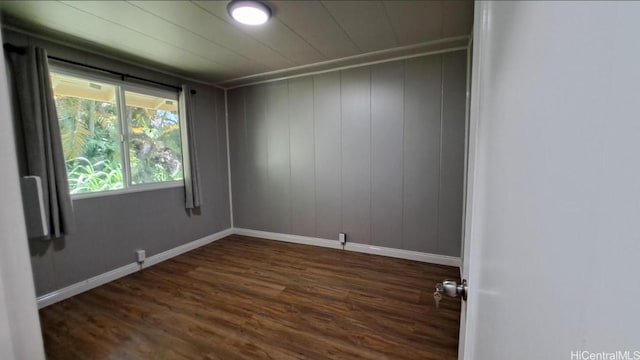 3904 Maunahilu Pl, Honolulu, HI 96816 - empty room featuring dark wood-style flooring and baseboards