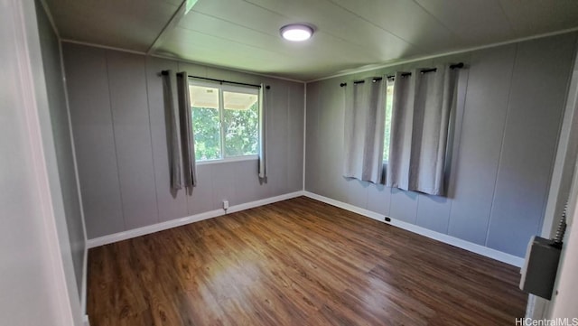 3904 Maunahilu Pl, Honolulu, HI 96816 - spare room featuring a decorative wall, wood finished floors, and baseboards