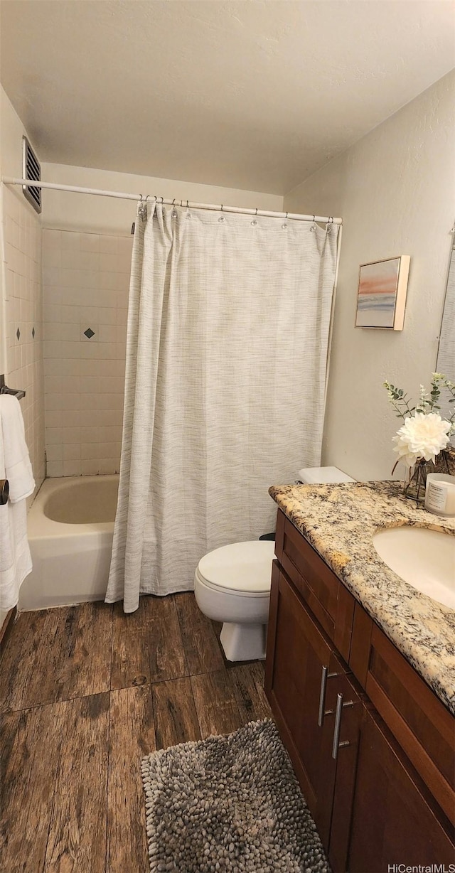 87-123 Helelua St Unit G307, Waianae, HI 96792 - full bathroom with vanity, wood finished floors, toilet, and shower / bath combo