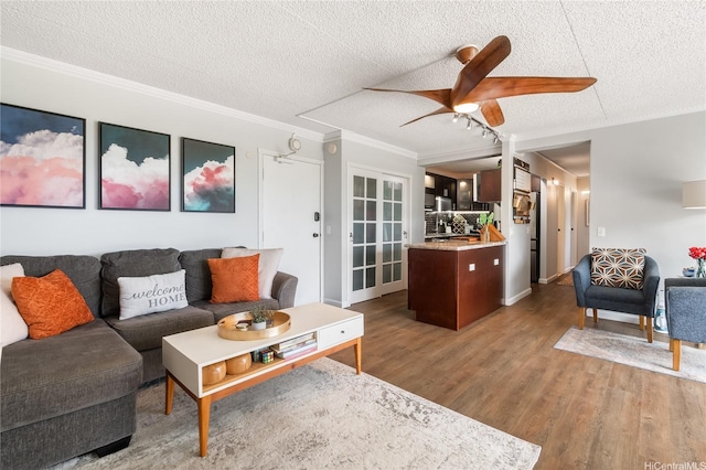 430 Keoniana St Unit 202, Honolulu, HI 96815 - living room with a textured ceiling, wood finished floors, crown molding, and ceiling fan