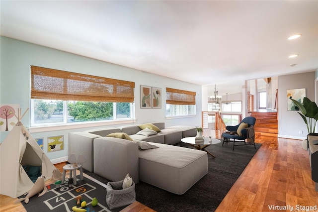 91-701B Oneula Pl, Ewa Beach, HI 96706 - living room with a chandelier, wood finished floors, baseboards, and recessed lighting
