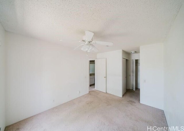 91-1089 Puamaeole St Unit 15C, Ewa Beach, HI 96706 - unfurnished bedroom featuring light colored carpet, a textured ceiling, and ceiling fan