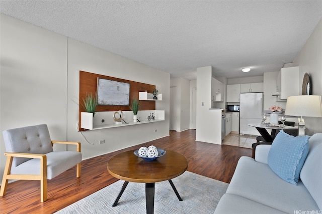 3161 Ala Ilima St Unit 1006, Honolulu, HI 96818 - living area with wood finished floors and a textured ceiling