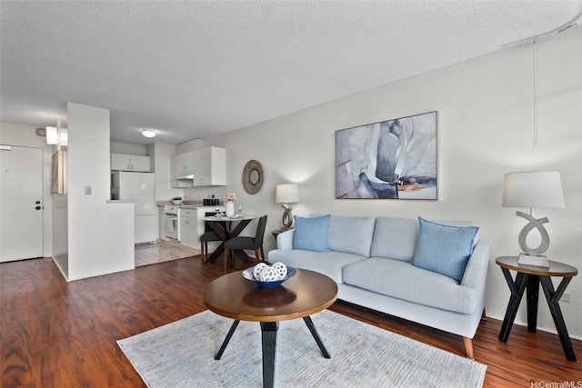3161 Ala Ilima St Unit 1006, Honolulu, HI 96818 - living area with light wood-type flooring and a textured ceiling