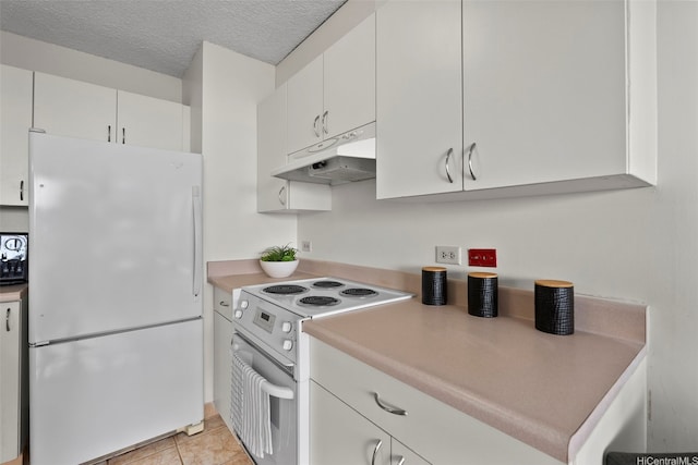3161 Ala Ilima St Unit 1006, Honolulu, HI 96818 - kitchen with white appliances, under cabinet range hood, light countertops, white cabinetry, and a textured ceiling