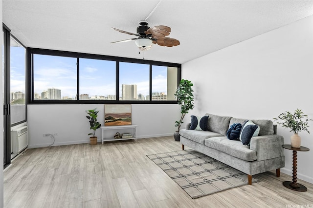 1571 Piikoi St Unit 503, Honolulu, HI 96822 - living room with ceiling fan, a view of city, light wood-type flooring, and baseboards