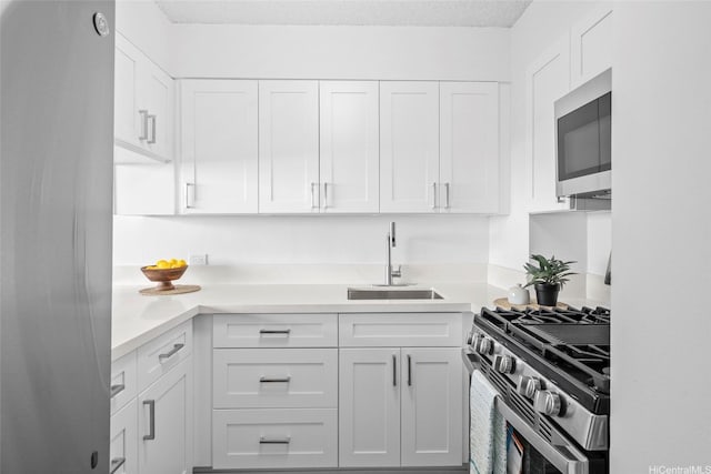 1571 Piikoi St Unit 503, Honolulu, HI 96822 - kitchen featuring stainless steel appliances, a sink, white cabinets, and light countertops