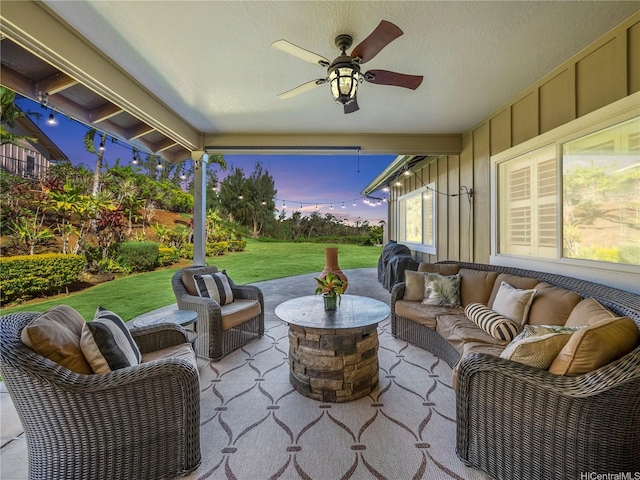 95-1073 Loea St, Honolulu, HI 96789 - patio terrace at dusk with an outdoor living space, a patio, a lawn, and ceiling fan