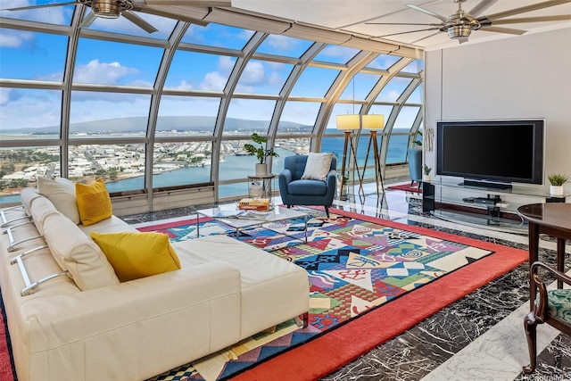 415 S St Unit 4202, Honolulu, HI 96813 - living room featuring a ceiling fan, healthy amount of natural light, marble finish flooring, floor to ceiling windows, and a sunroom