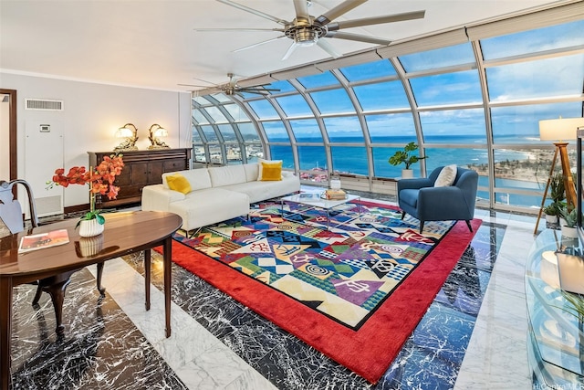 415 S St Unit 4202, Honolulu, HI 96813 - living area featuring a ceiling fan, a sunroom, a water view, and marble tiled floors