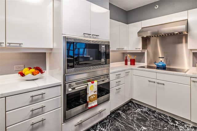 415 S St Unit 4202, Honolulu, HI 96813 - kitchen featuring wall chimney exhaust hood, black electric cooktop, oven, built in microwave, and white cabinetry