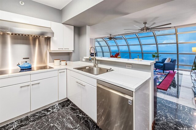 415 S St Unit 4202, Honolulu, HI 96813 - kitchen featuring stainless steel dishwasher, a sink, dark marble finish floors, a peninsula, and black electric stovetop