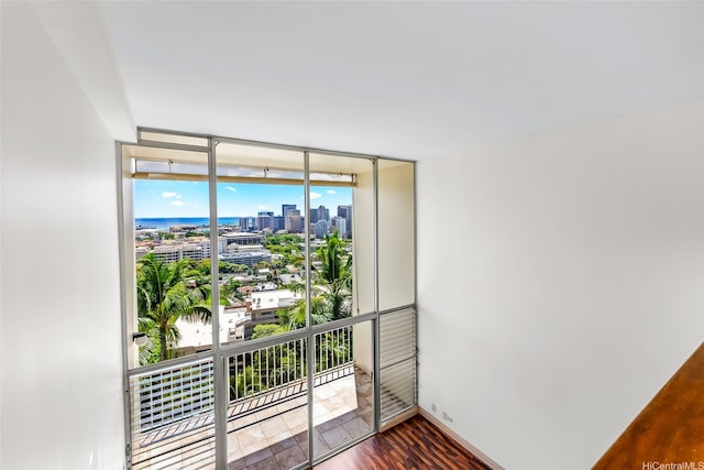 666 Prospect St Unit I506, Honolulu, HI 96813 - unfurnished room featuring a city view, floor to ceiling windows, and dark wood-style floors