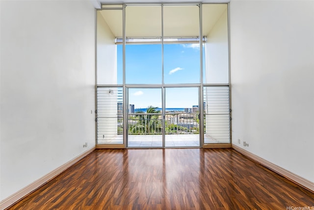 666 Prospect St Unit I506, Honolulu, HI 96813 - spare room featuring expansive windows, baseboards, and wood finished floors