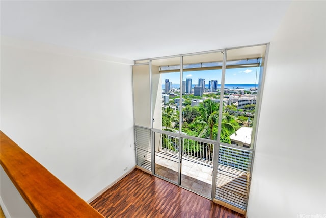 666 Prospect St Unit I506, Honolulu, HI 96813 - spare room with a view of skyline, wood finished floors, and floor to ceiling windows