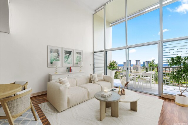 666 Prospect St Unit I506, Honolulu, HI 96813 - living room with a towering ceiling, floor to ceiling windows, wood finished floors, and a city view